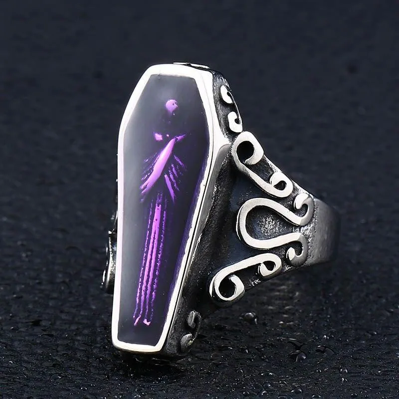 Ring mit violettem Kristall und Sargdesign